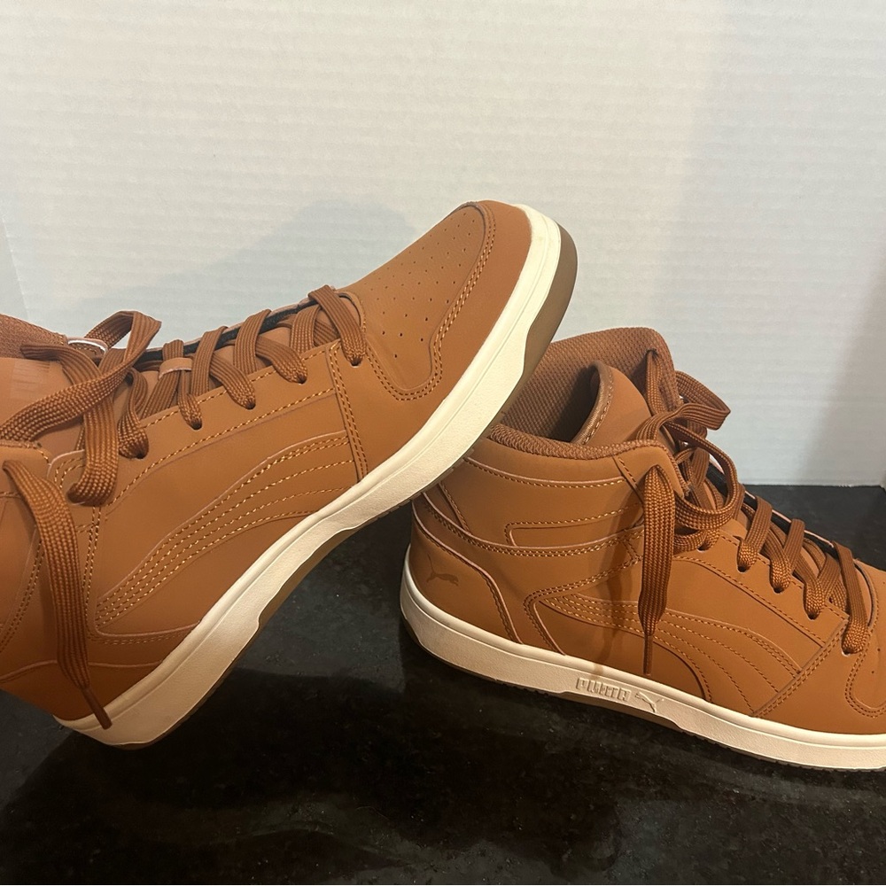 Puma tan suede mid sneakers. are like new condition. Only wore 1 time and I